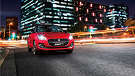 front-shot-of-red-Swift-running-in-night-city